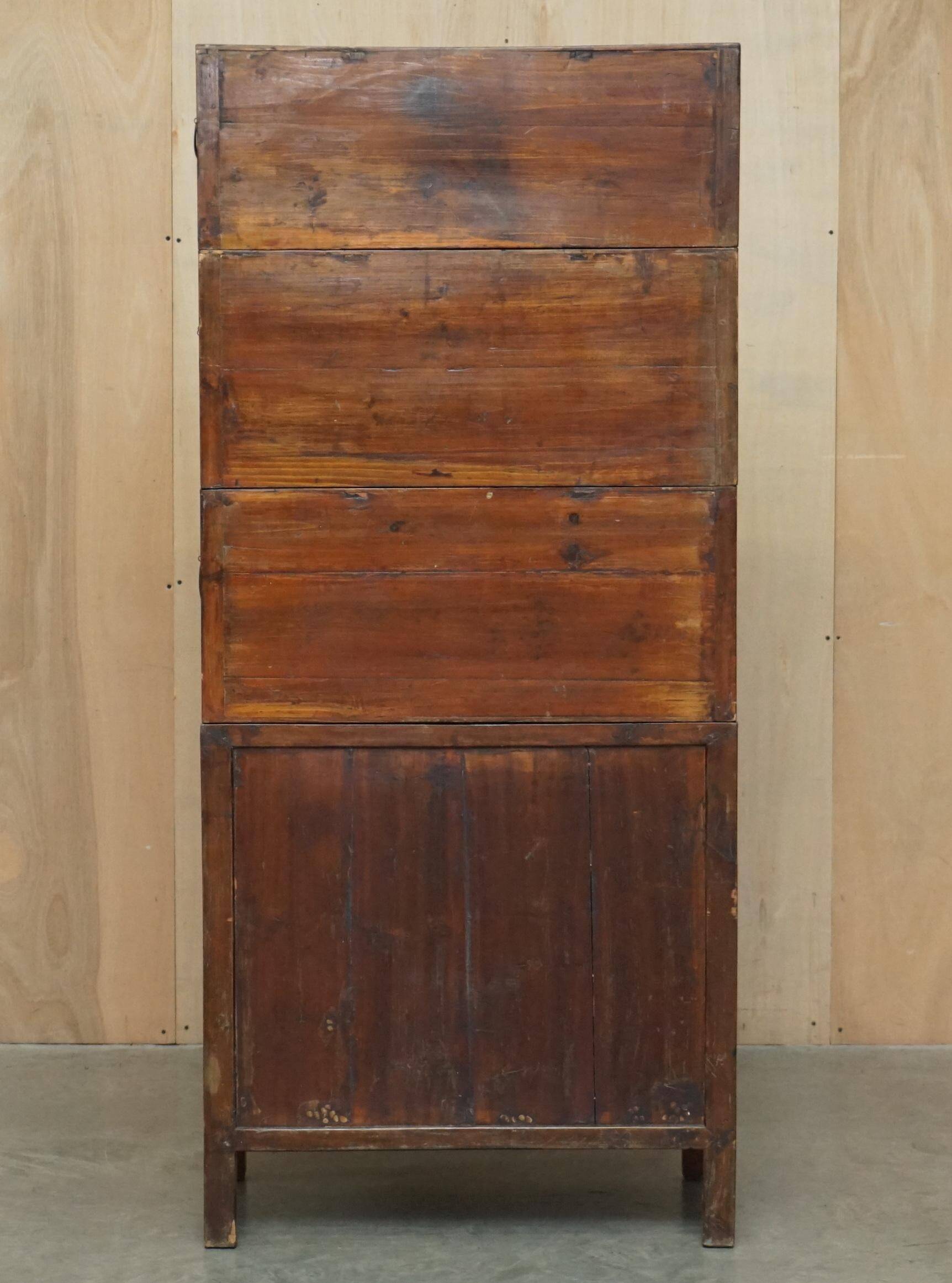 Antique Chinese armoire hand-carved around 1880 with country-style handles.