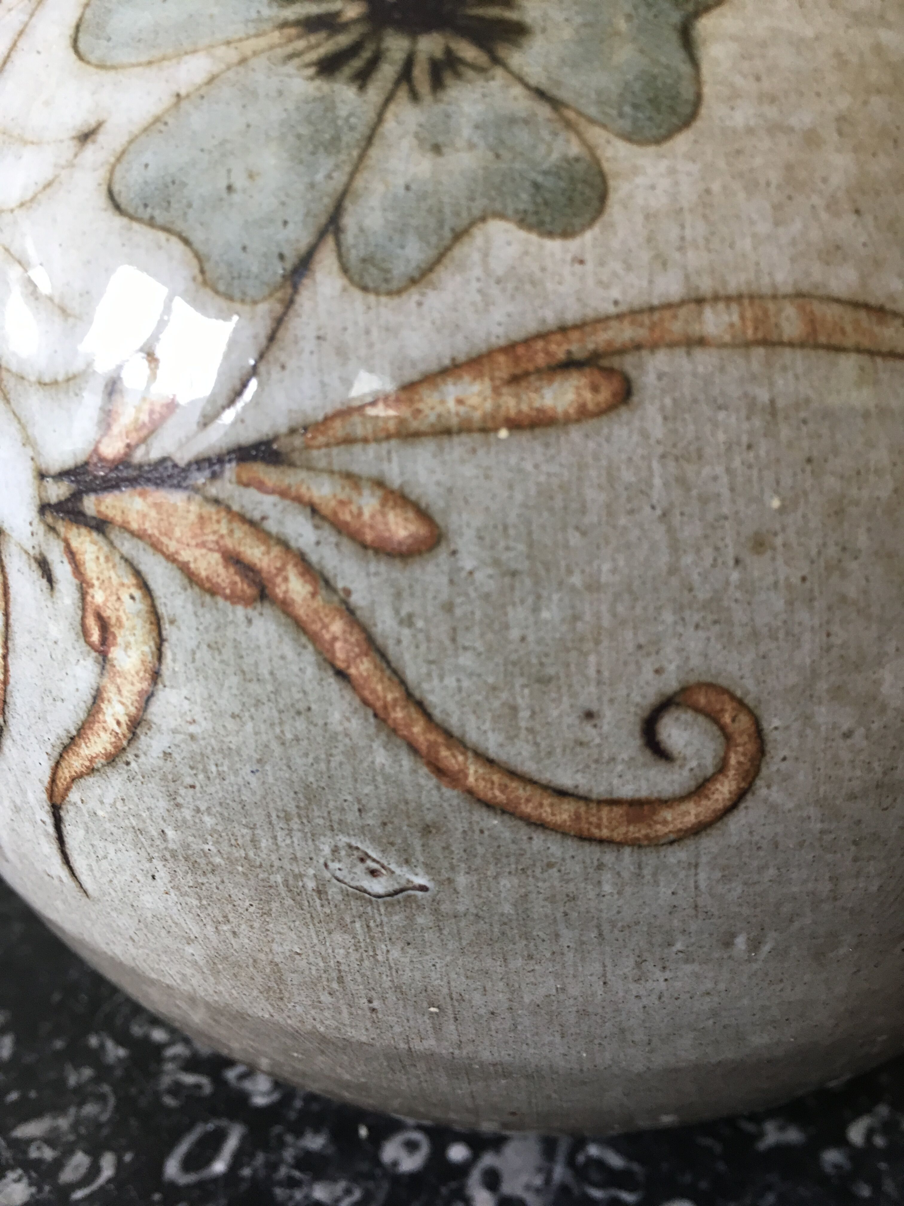 Glazed stoneware ball vase decorated with flowers