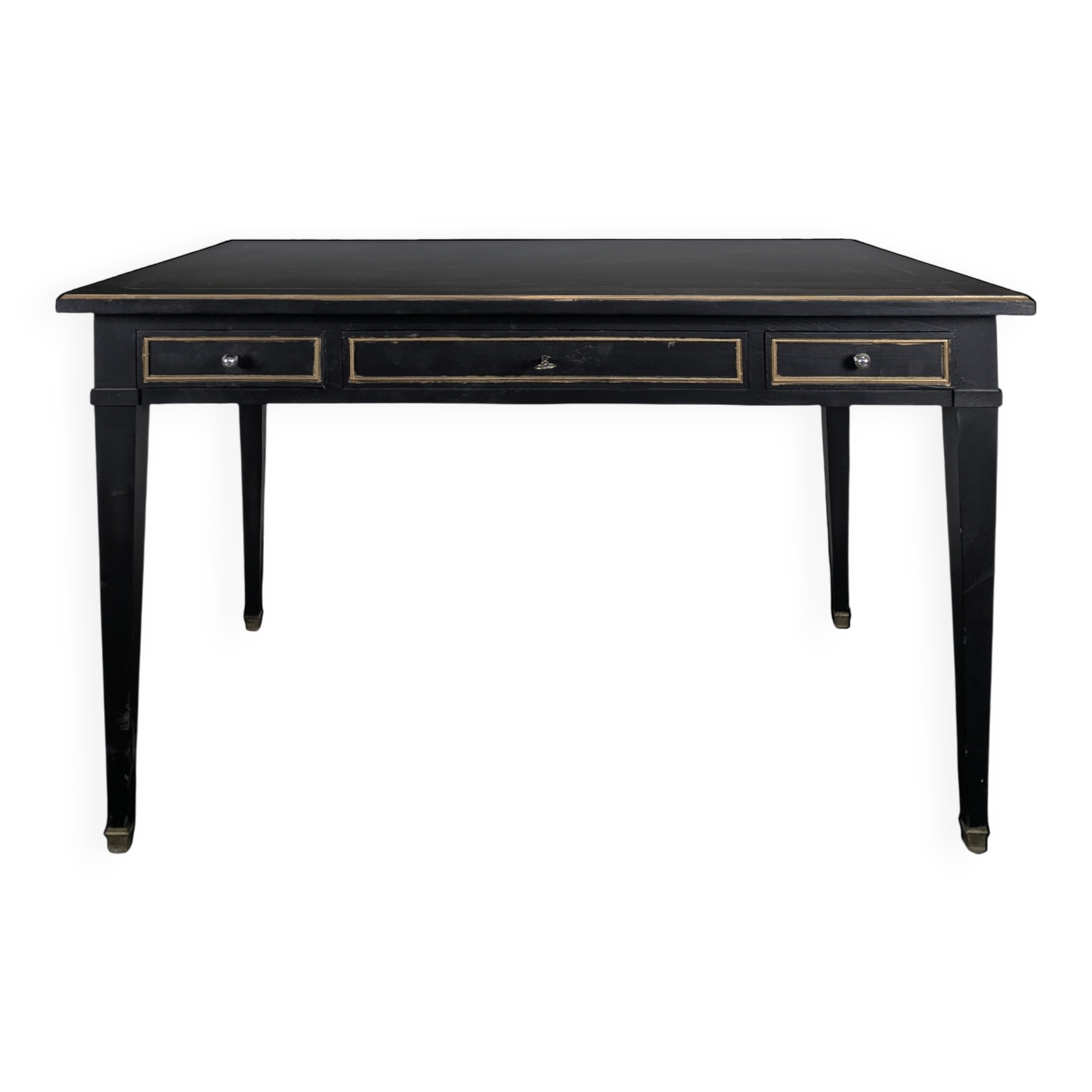Large flat desk in Louis XVI style, black lacquered with gold highlights.