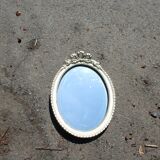 Oval mirror with golden knot
