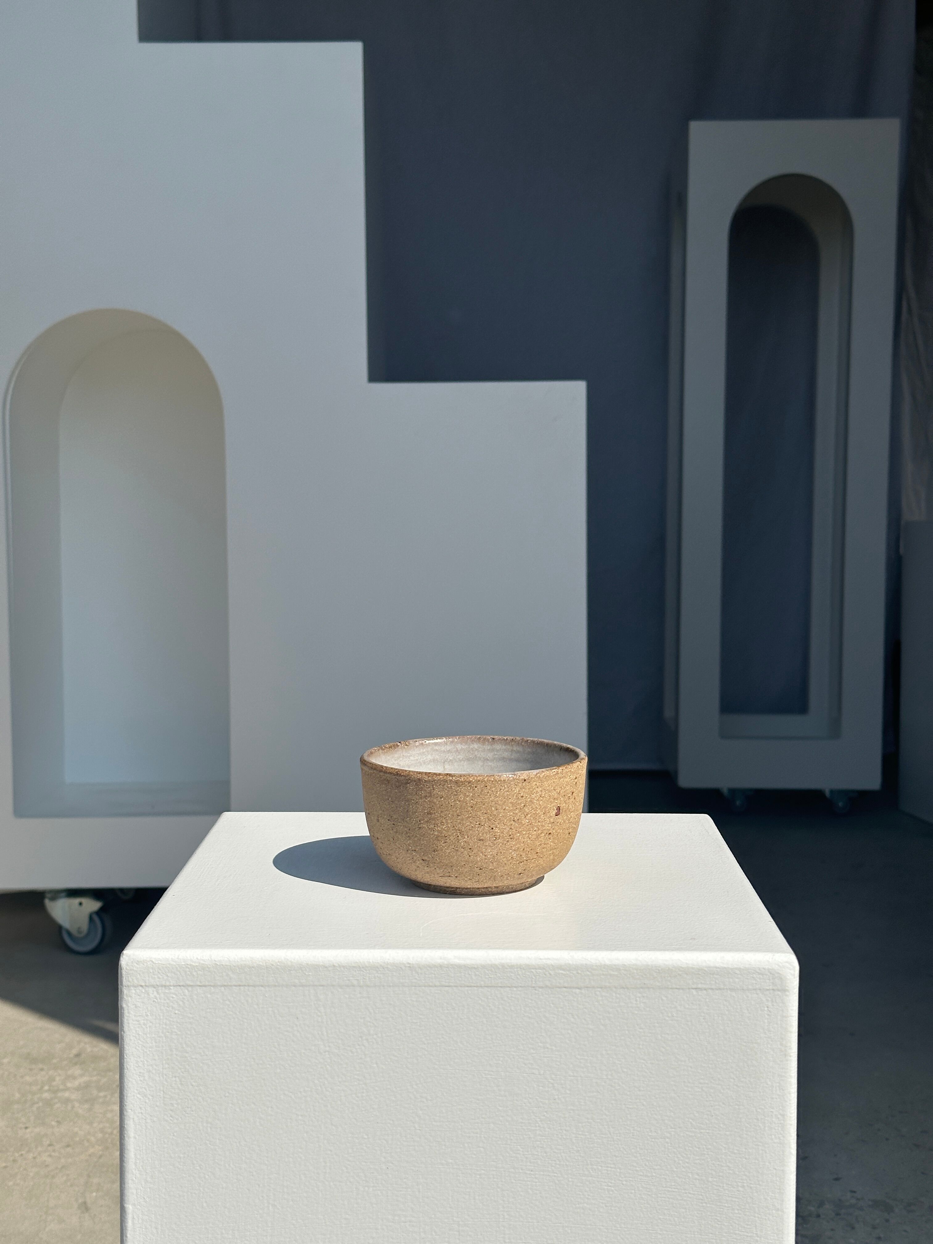 Small brown bowl inside blue and white