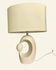 Cream ceramic table lamp with a mid-century design, featuring a lampshade.
