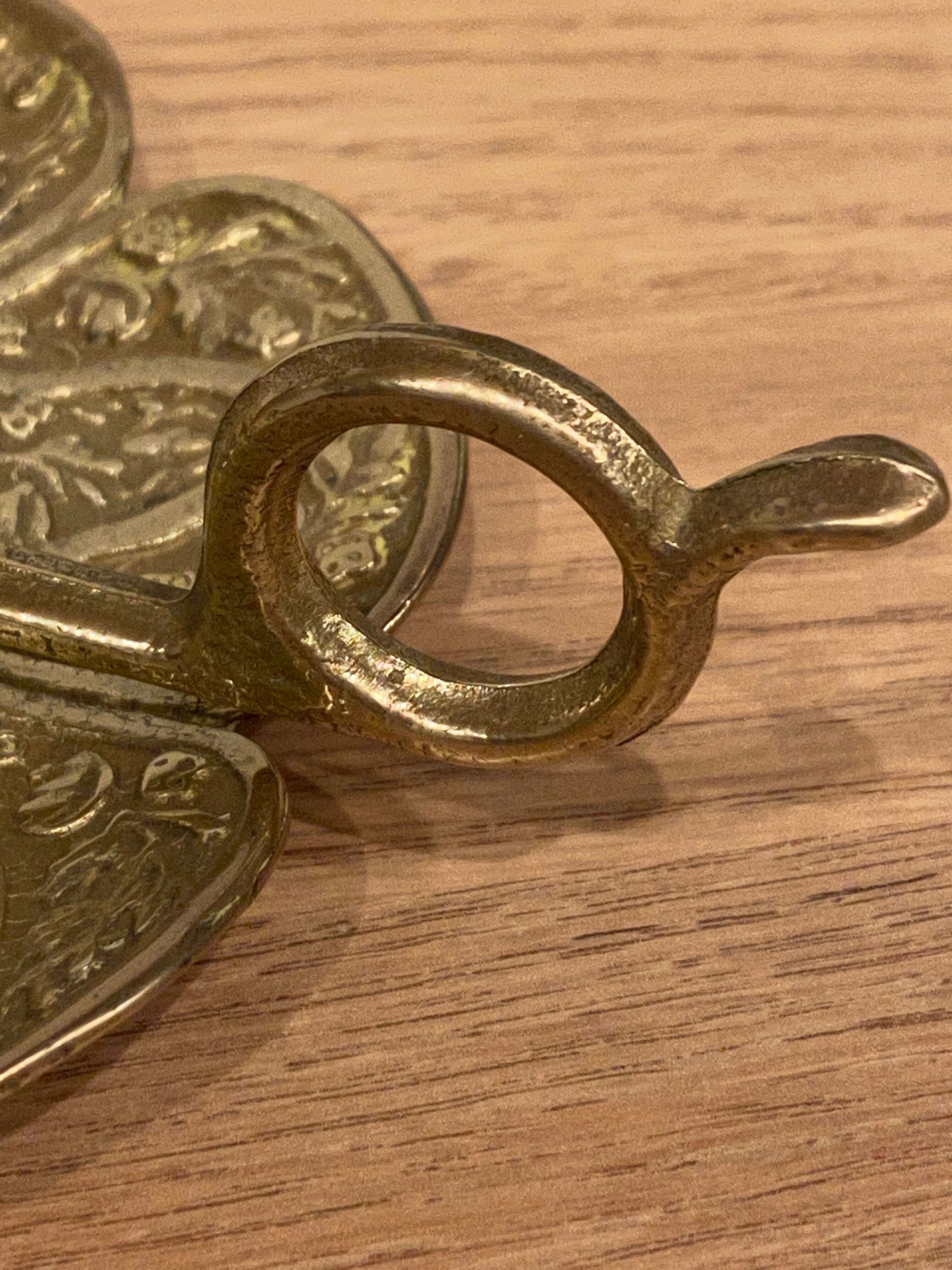 Brass candle holder on frame