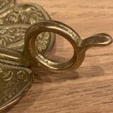 Brass candle holder on frame