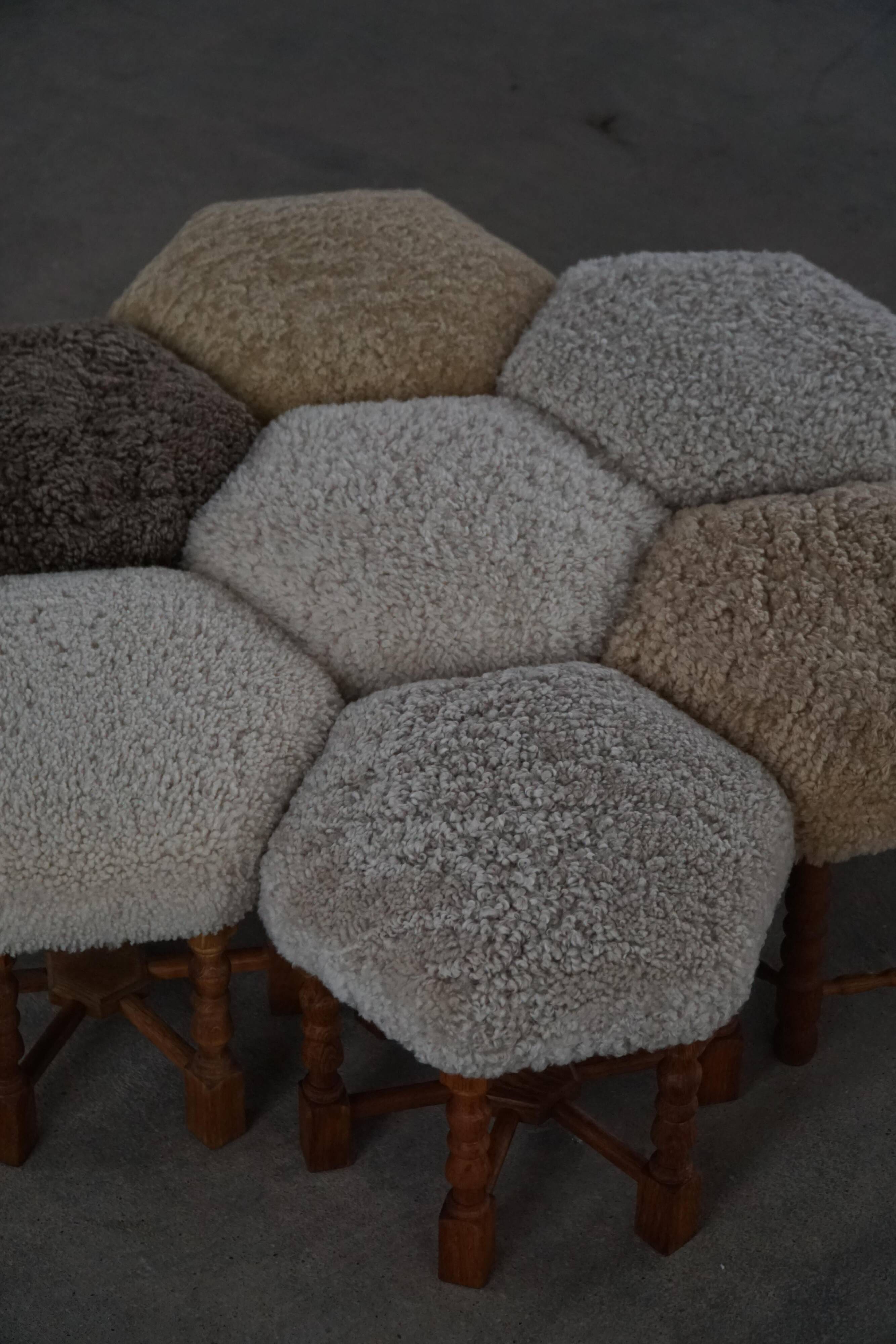 Pair of Danish oak stools from the mid-century with hexagonal seat and turned legs, 1950s.