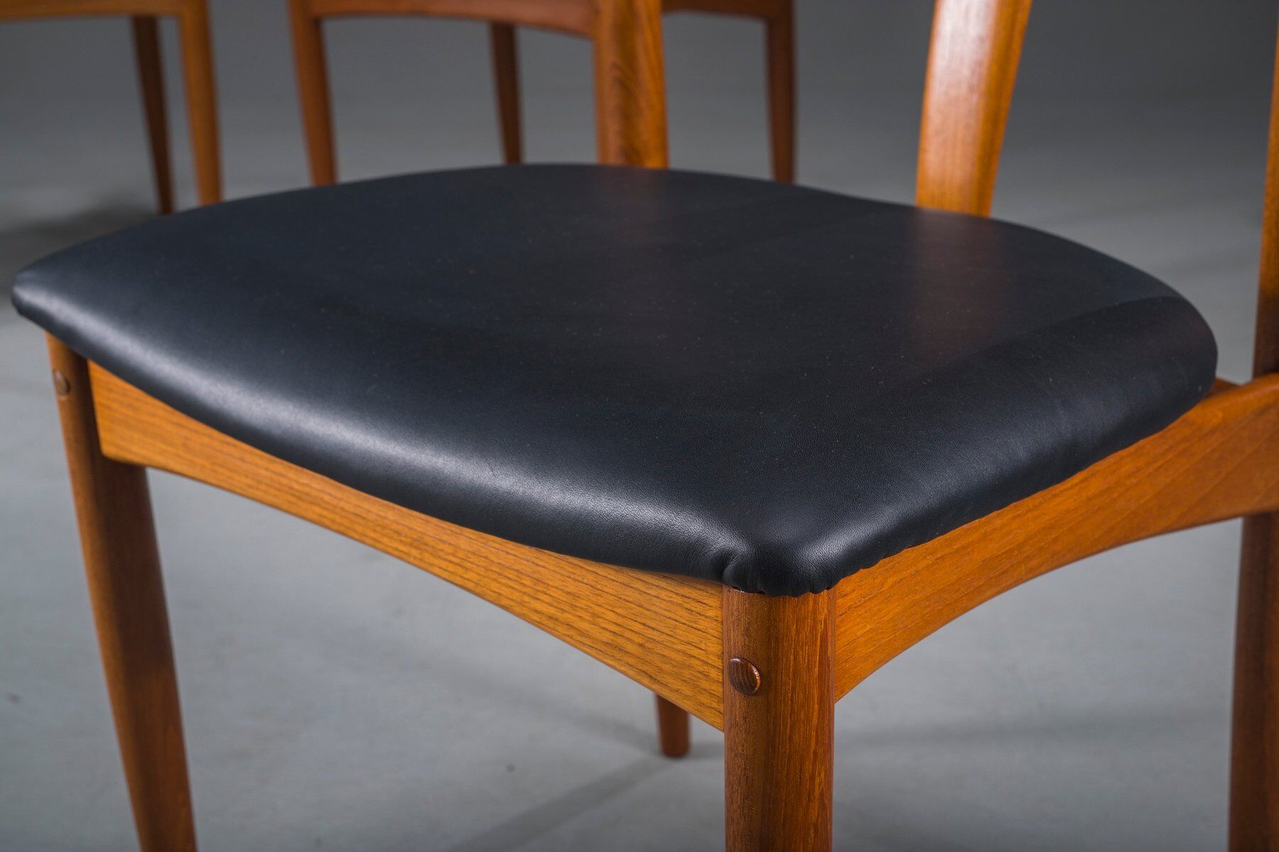 Juliane dining chairs in teak and black leather by Johannes Andersen for Uldum Møbelfabrik, Denmark, 1960s, set of 6