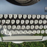 Typewriter blue japy script  with manual and carrying case