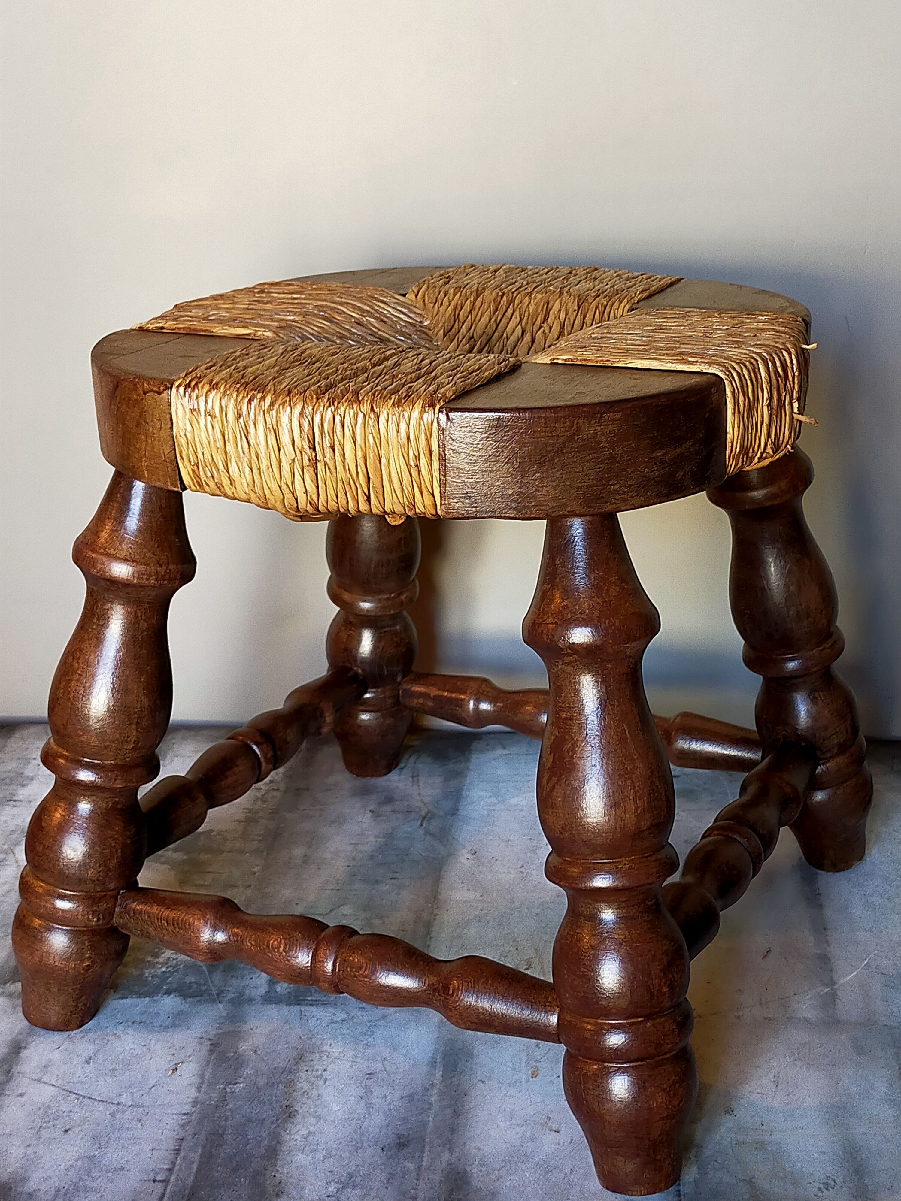 Low vintage regional stool in solid wood with straw top