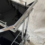 Modernist serving trolley in chromed metal and black smoked glass