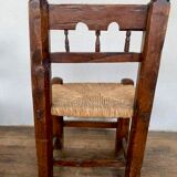 Series of 4 brutalist rustic chairs in carved wood straw seat