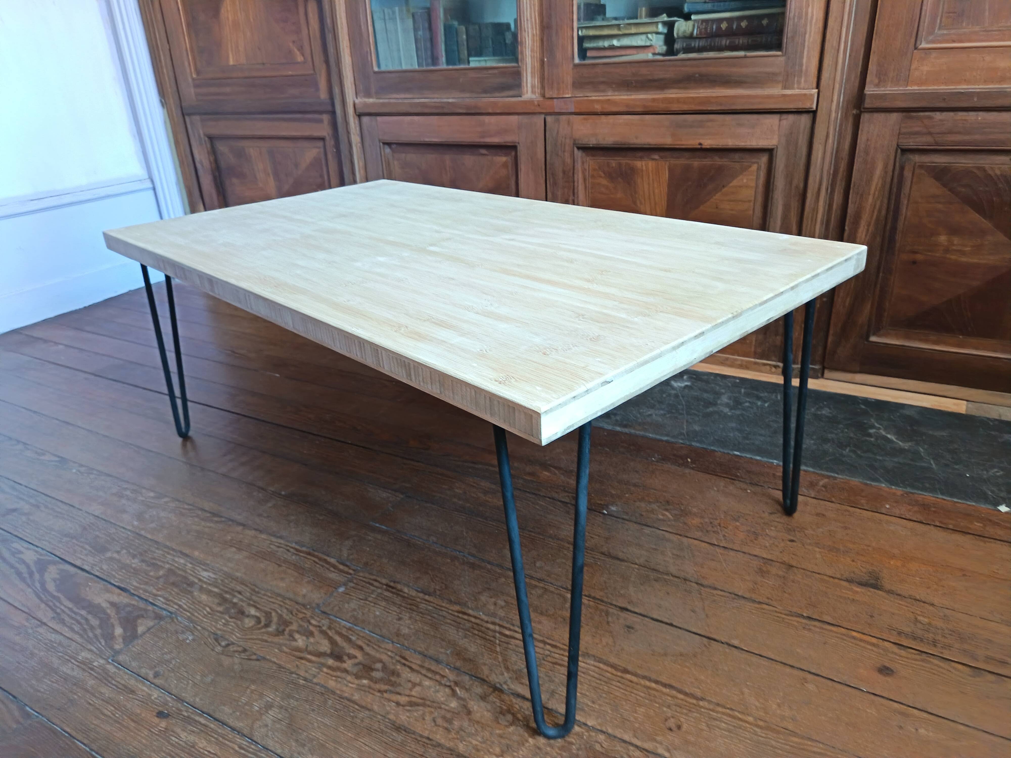 Coffee table in solid bamboo with steel legs.