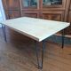 Coffee table in solid bamboo with steel legs.
