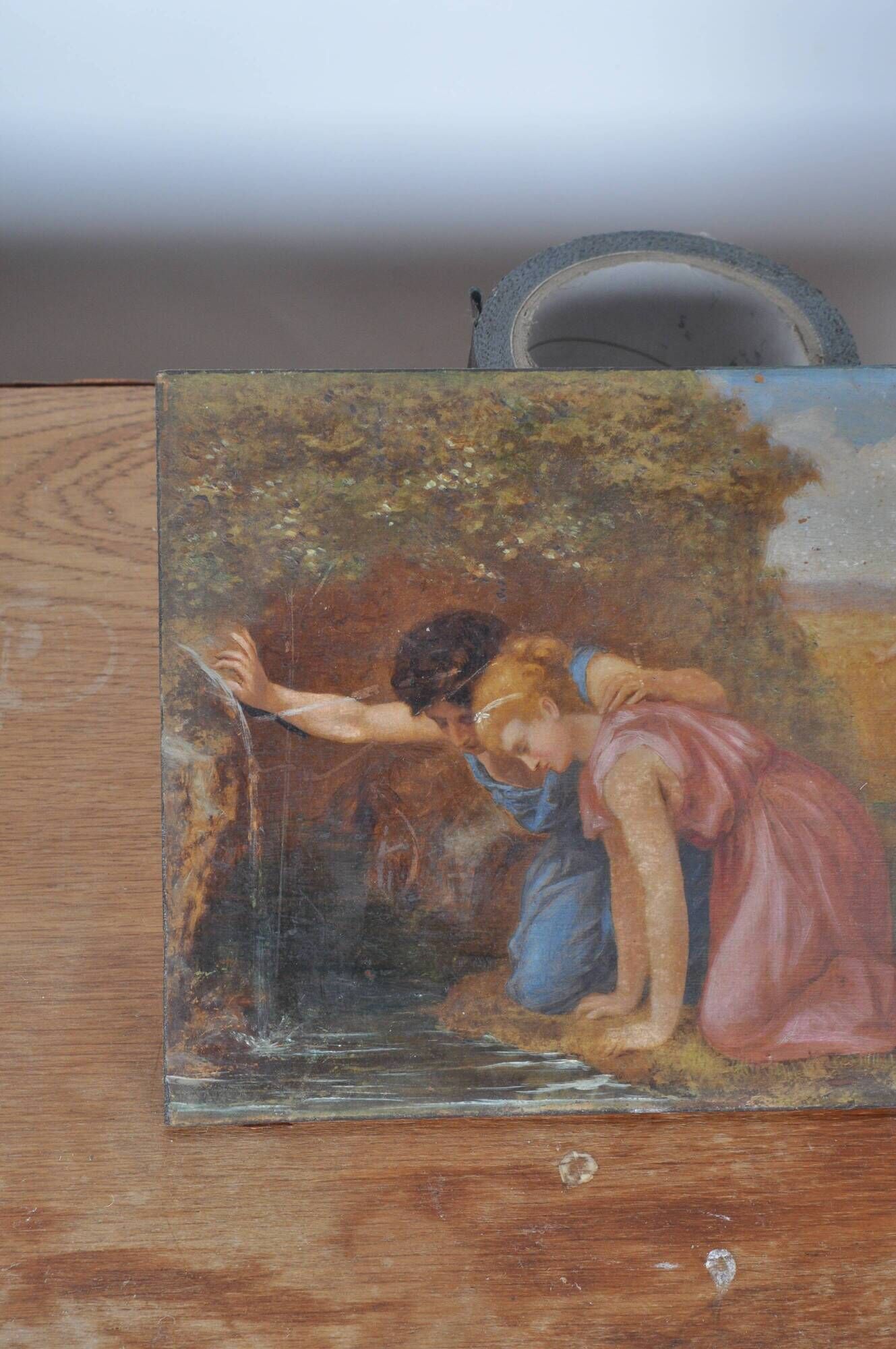 Painting on wood "Cupid and a couple at the fountain".