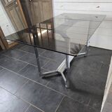 Chromed metal table with smoked glass top