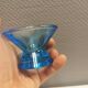 Two small candle holders in blue glass from the well-known Finnish company Ittala.