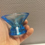 Two small candle holders in blue glass from the well-known Finnish company Ittala.