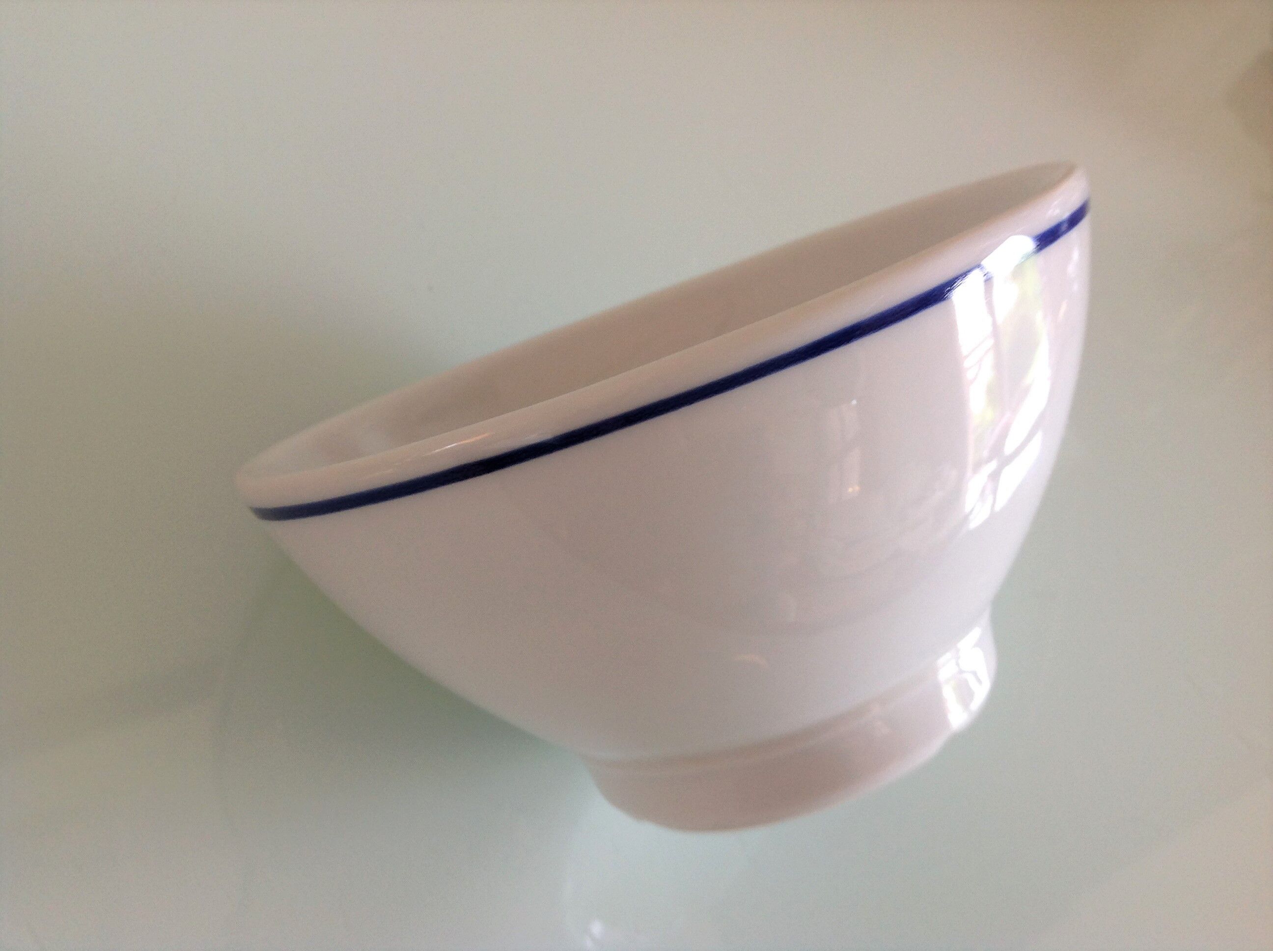White bowl with blue border of the faienceries of Sarreguemines