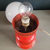 Vintage globe lamp with a metal base, perforated and lacquered in red.