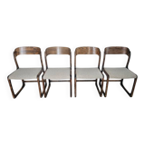 Set of 4 vintage Baumann "Sled" chairs in bent wood.