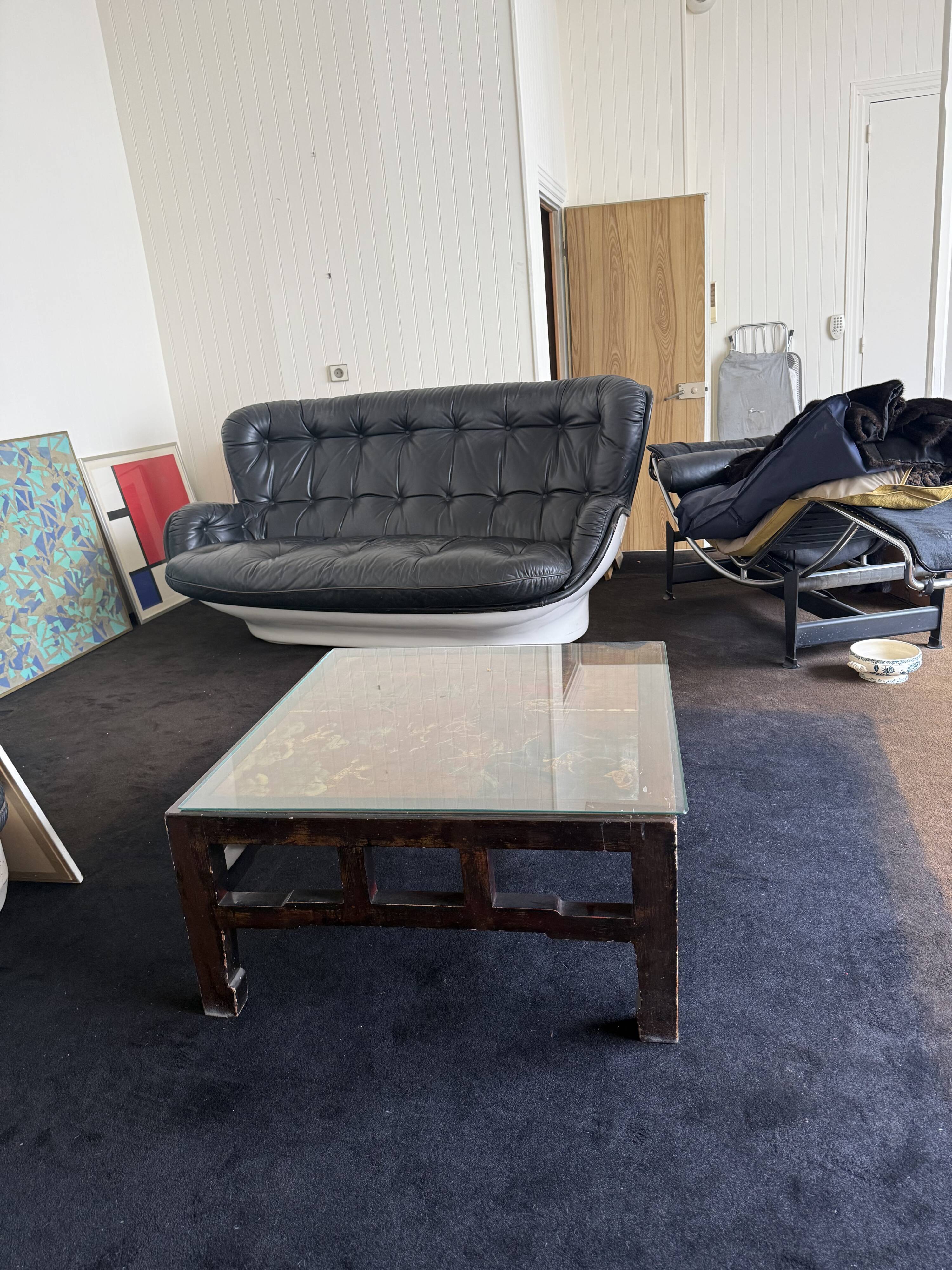 Vintage brutalist coffee table with Asian decor.