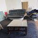 Vintage brutalist coffee table with Asian decor.