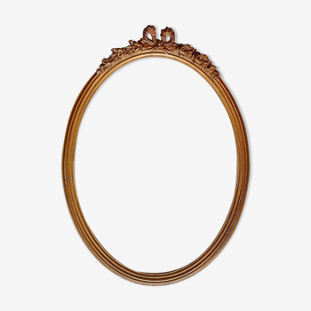Oval frame with gilded pediments 19th wood and stucco