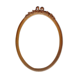 Oval frame with gilded pediments 19th wood and stucco