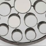 Mirror with round facets design