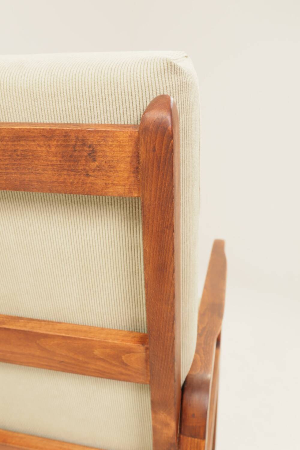 Vintage armchair in olive corduroy with a wooden frame.