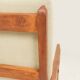Vintage armchair in olive corduroy with a wooden frame.