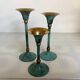 Set of candlesticks with green patina and brass Memphis