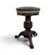 Green velvet piano stool with a turned leg.