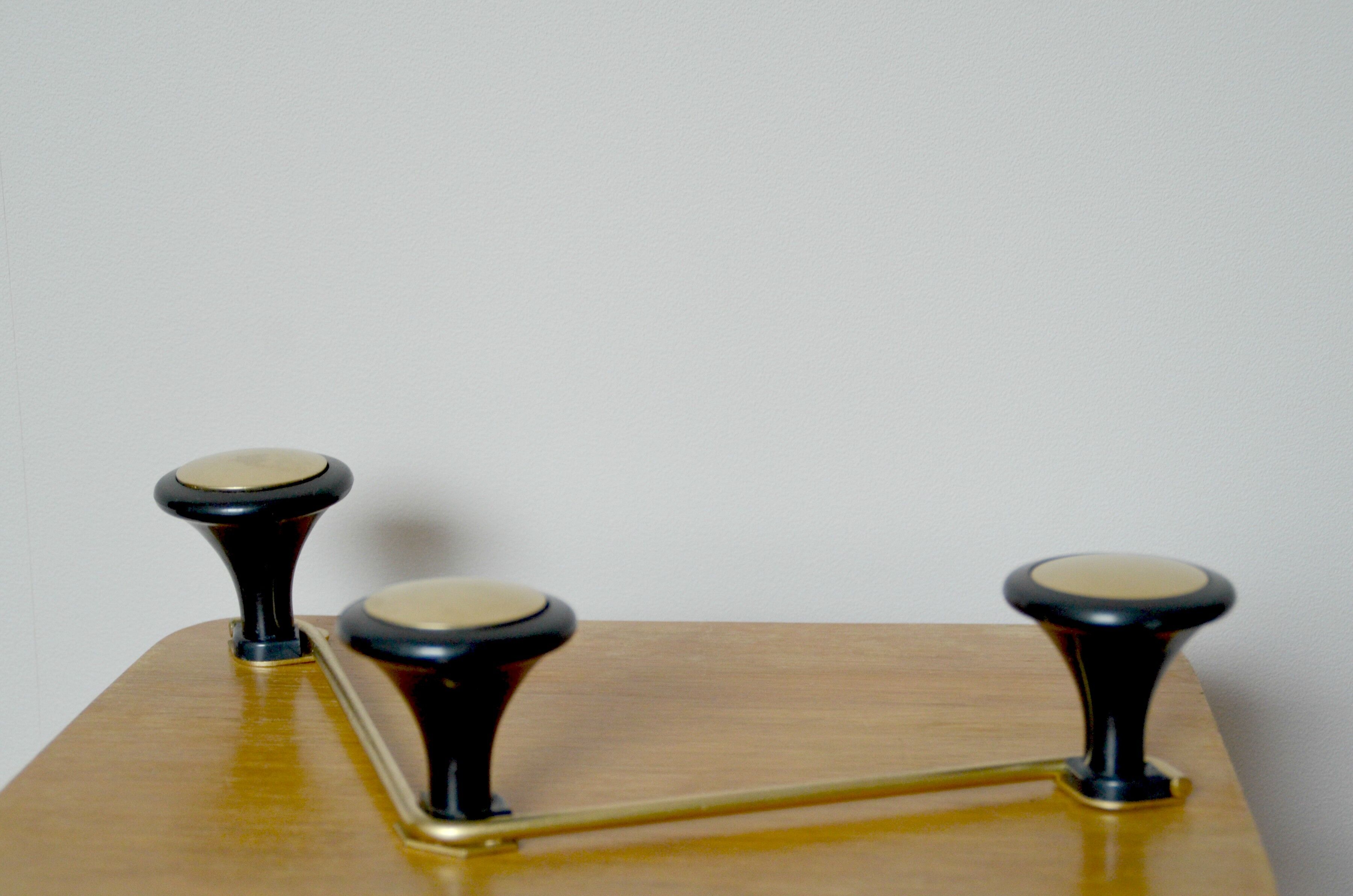 Coat rack, coat hook in gold metal and head black bakelite