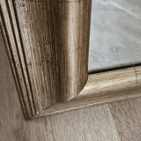 Beveled mirror under gold frame