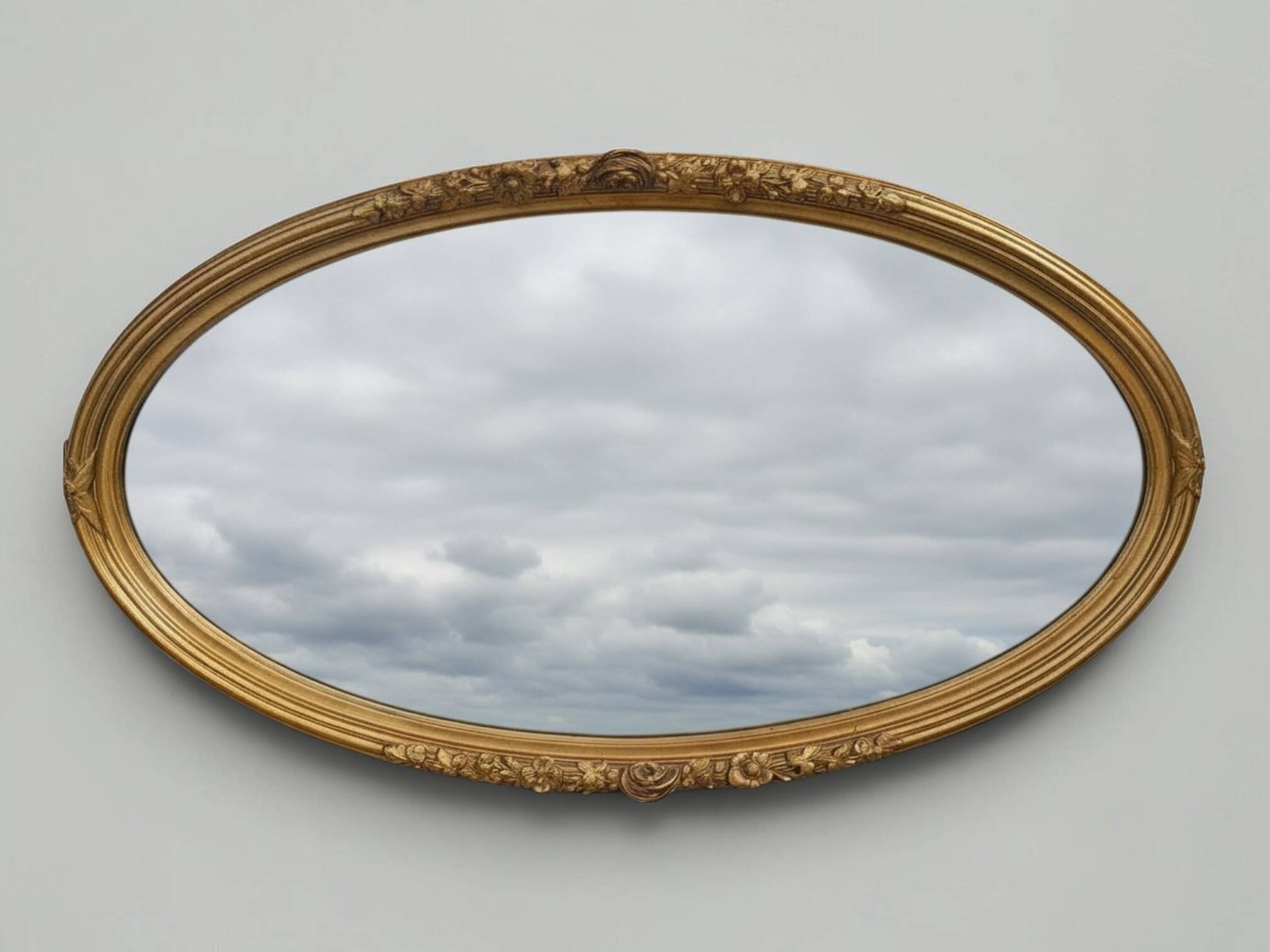 Miroir ovale en bois doré, style Louis XVI