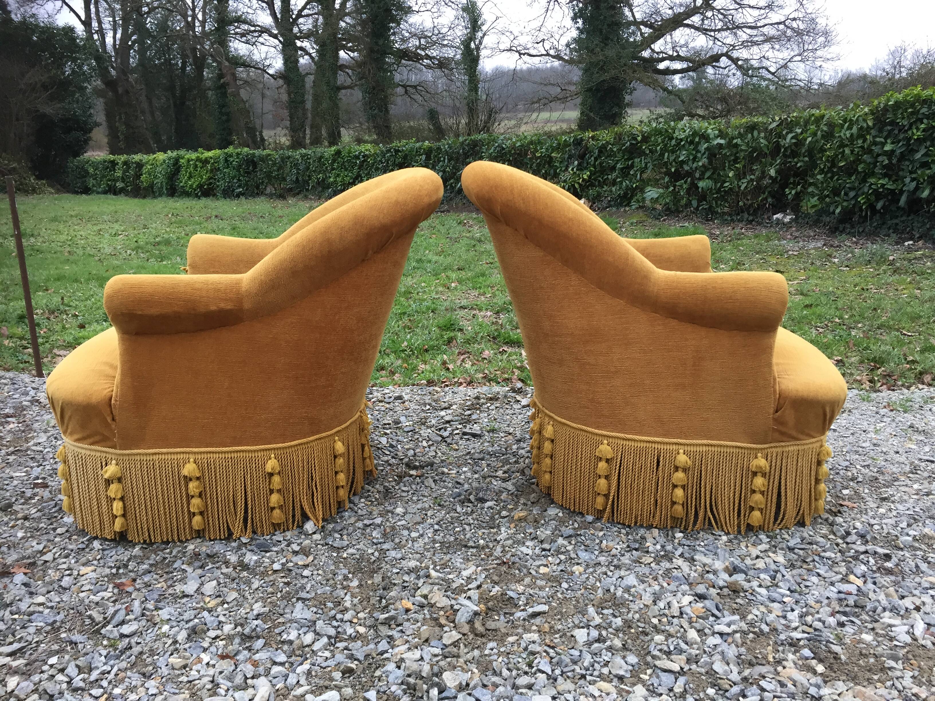 Duo de fauteuils vintage crapaud en tissu or