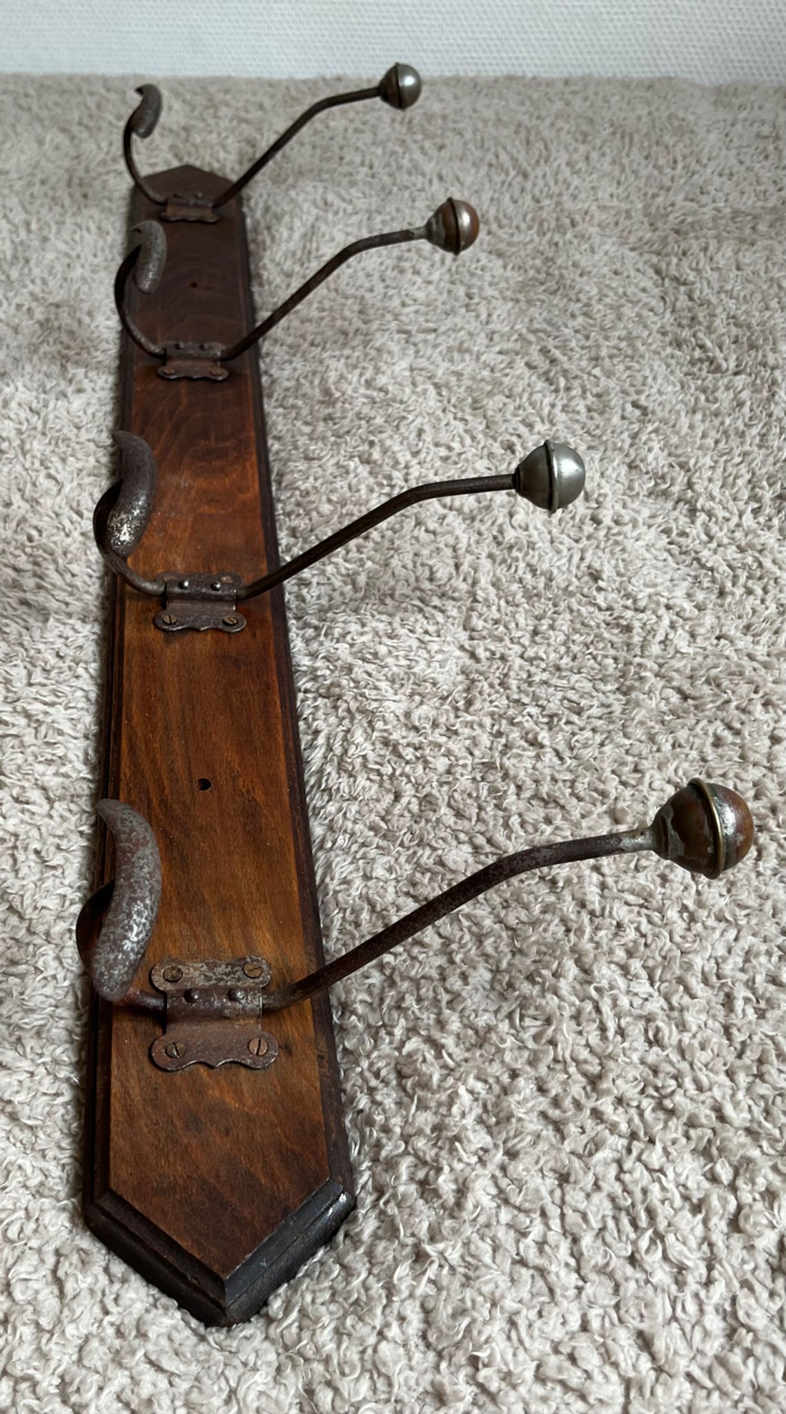 Old coat rack with metal/brass hooks