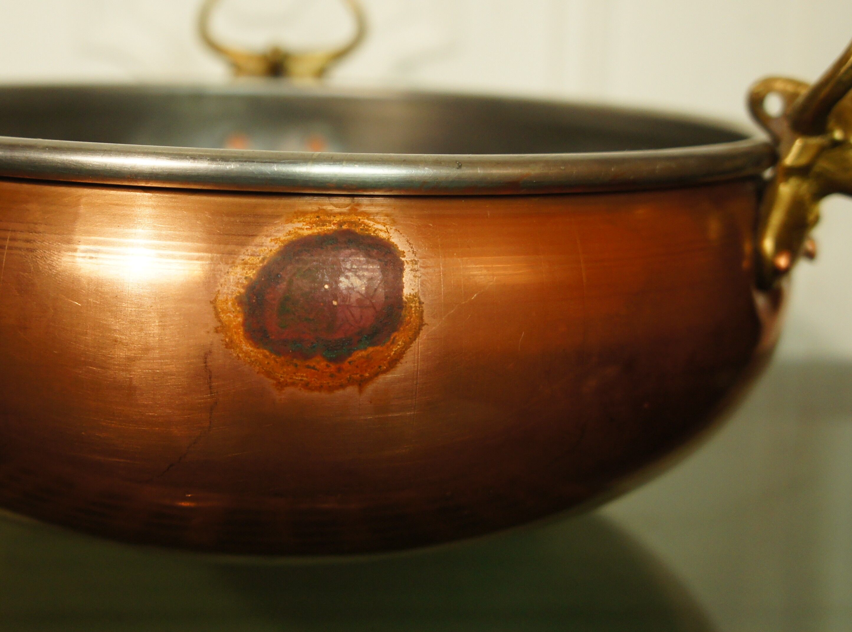 Copper cauldron with golden bronze bull heads
