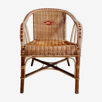 Old chair in rattan and wood
