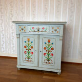 Antique low polychrome sideboard with floral decoration.