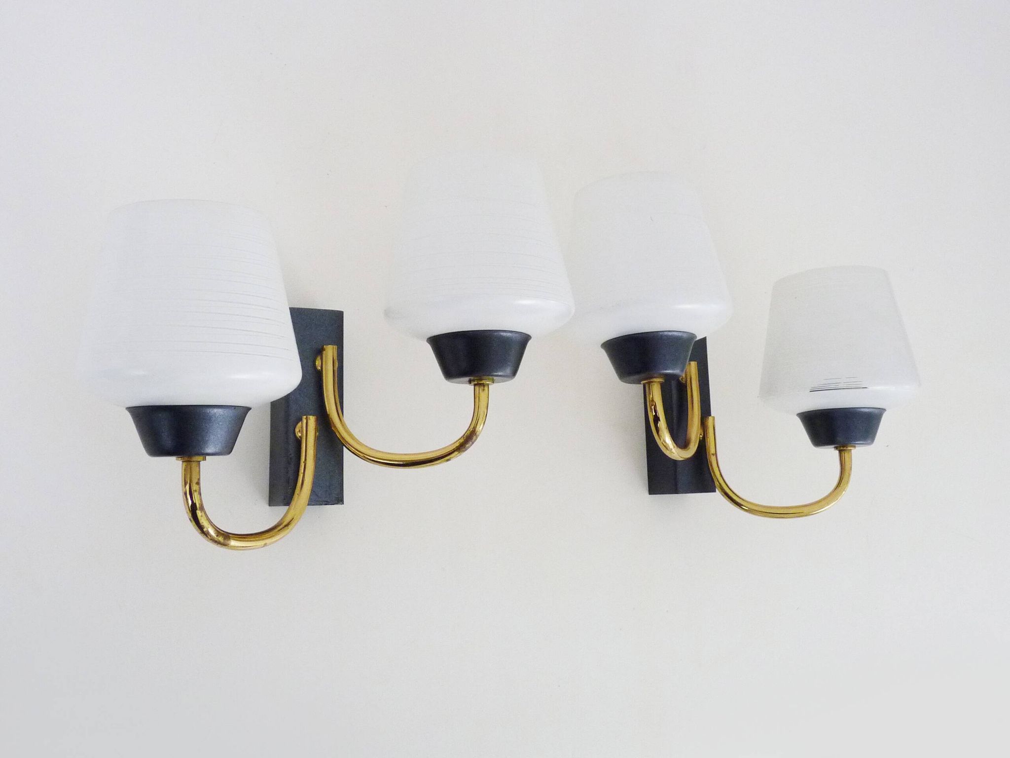 Pair of vintage Maison Arlus wall lights from the 1950s in brass, glass globe.