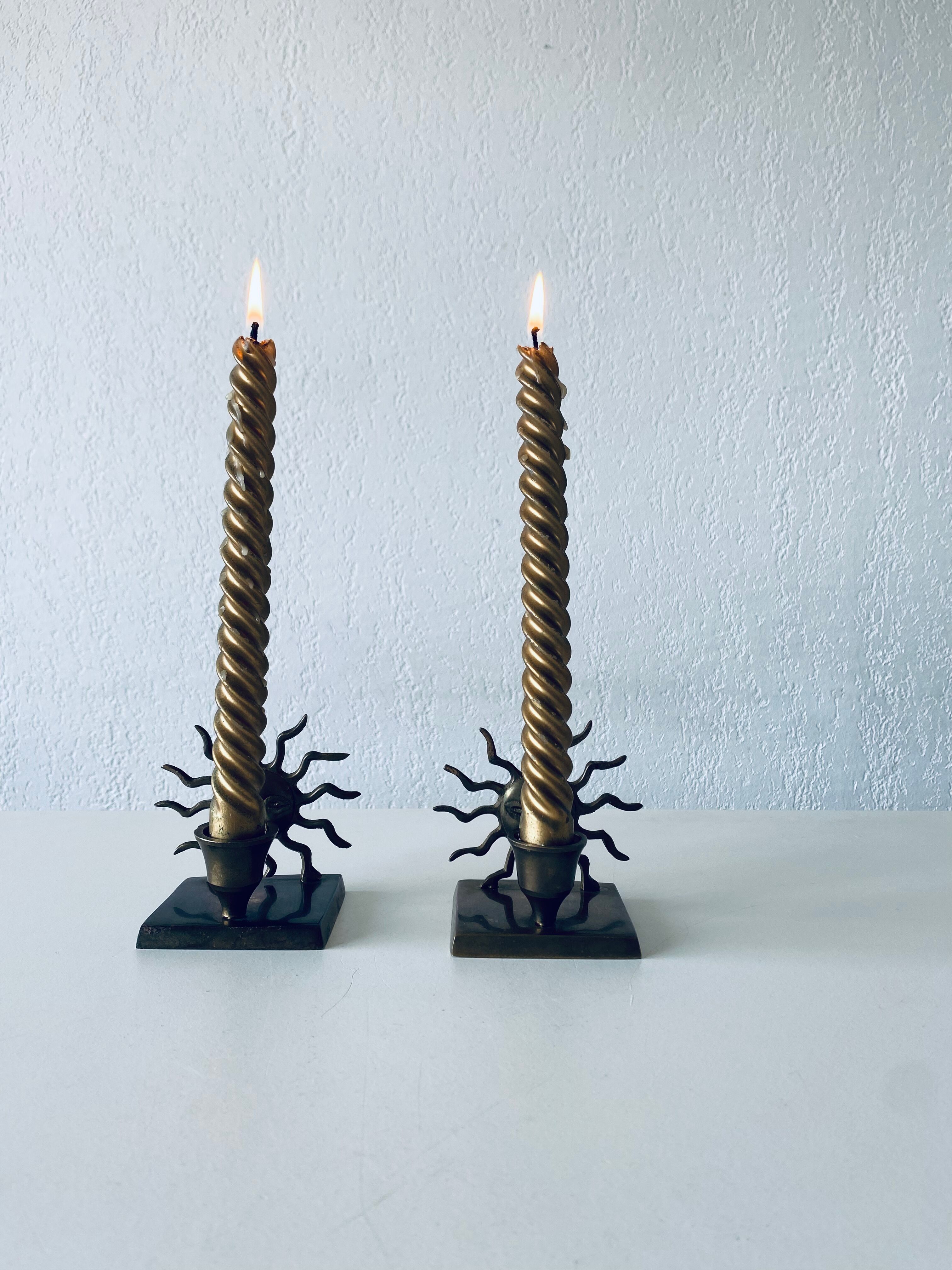 Pair of sun candle holders