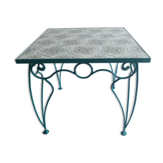 Wrought iron table and cement tile
