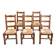 Set of 6 wooden chairs with straw seats and high backs.