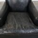 Armchair in black grained cowhide leather with a deep seat