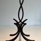 Pair of Wrought Iron Andirons with Stylised Flamboyant Uprights and Enrobed Feet