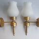Three Empire style golden torch wall sconces