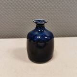 A small vase with blue running glaze with a ‘thin’ neck, from Swedish Kjell Sunesson