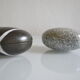2 boxes in lithographed sheet metal in the shape of a pebble