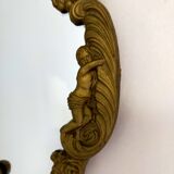 Gilded bronze mirror with angels and scrolls